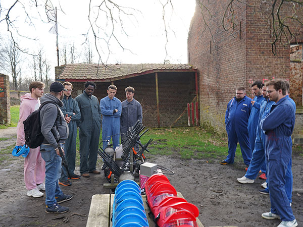 A group of adults getting ready for a game of paintball as a team-building activity outdoors in Waterloo Outdoor paintball group for adults in Waterloo – Wild missions and a festive atmosphere