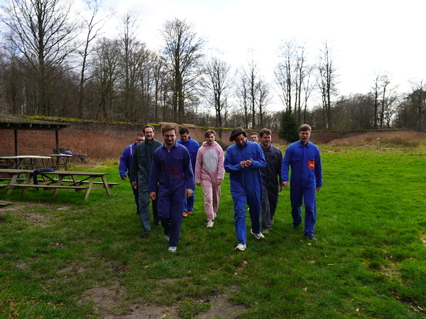 Group of adults celebrating a birthday with an activity paintball outdoors near Tervuren