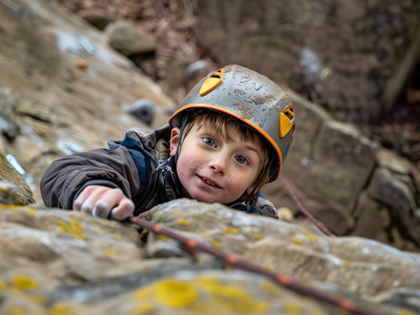 Child wearing protective gear playing a game of paintball in a safe environment on the eve a birthday party near Tervuren
