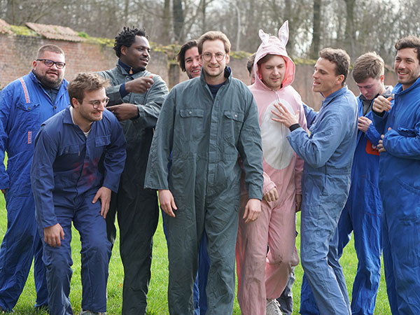Colleagues from a company taking part in a paintball team-building event near Ottignies